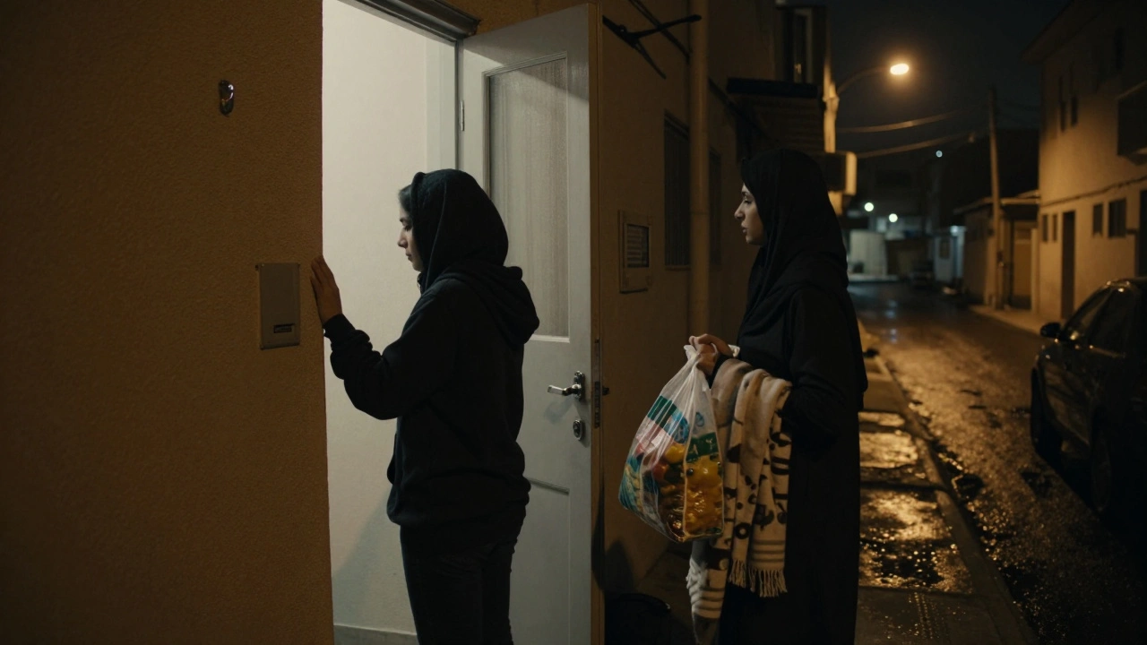 A volunteer opens a door at night to offer food and shelter to a woman in need.